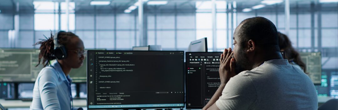 Sick IT professional in server hub sneezing while shielding data from potential threats using PC. Ill employee suffering from flu safeguarding data center against unauthorized access, camera A