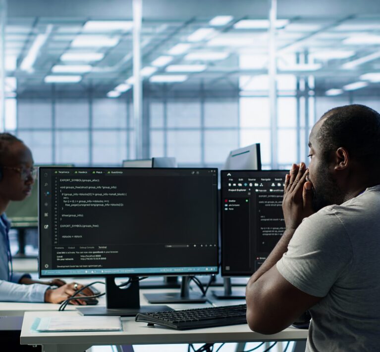 Sick IT professional in server hub sneezing while shielding data from potential threats using PC. Ill employee suffering from flu safeguarding data center against unauthorized access, camera A